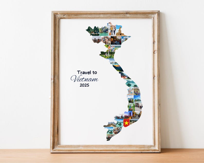 May include: Framed print featuring a collage of images forming the shape of Vietnam. The print includes the text "Travel to Vietnam 2025" in elegant script. The frame is a light brown color, and the print is displayed on a wooden surface.