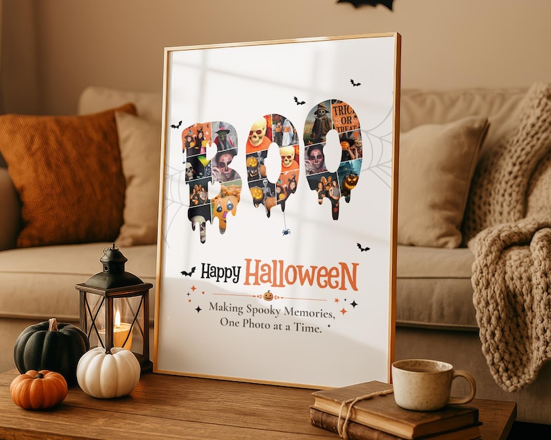 May include: A vertical rectangular poster in a thin gold frame featuring the word BOO in large, dripping letters filled with a collage of various Halloween-themed photos. Below, the text reads Happy Halloween and Making Spooky Memories, One Photo at a Time.