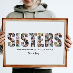 May include: A framed photo collage with the word "SISTERS" spelled out using photos of people. The text below the collage reads "Forever linked by heart and soul" and includes the names "Olivia" and "Emily".