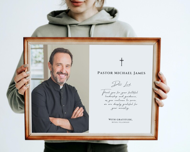 May include: A wooden framed portrait of Pastor Michael James. The left side shows a smiling man in a black clerical shirt. The right side has text including "Dear Lord" and "Thank you for your faithful leadership and guidance."