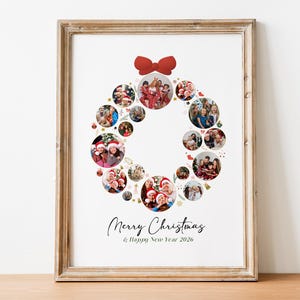 May include: Framed Christmas wreath photo collage with a red bow at the top. The wreath is composed of circular photos of people. The text "Merry Christmas & Happy New Year 2026" is written in a script font.