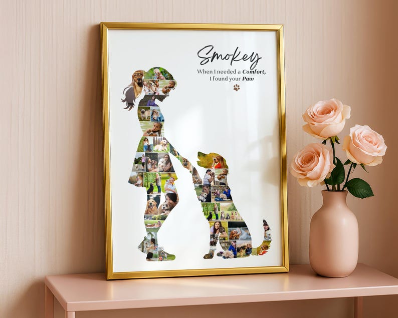 May include: A framed wall art print featuring a collage of photos arranged into the silhouettes of a person and a dog. The text reads Smokey, When I needed a Comfort, I found your Paw, with a small paw print icon. The frame is gold-coloured metal.