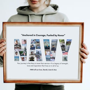 May include: A framed print with the word "NAVY" spelled out in a collage of photos. The print has a brown wooden frame and includes the text "Anchored in Courage, Fueled by Honor." Additional text reads, "Your journey in the Navy is more than service..." and "With all our love, Sarah, Liam & Ava."