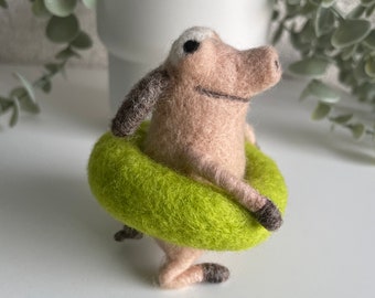 Funny bathing pig with swimming ring, felt figure