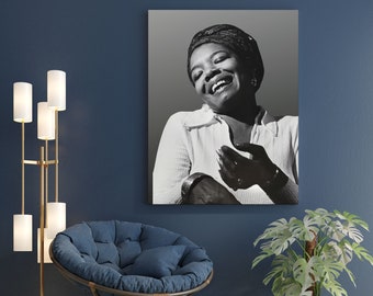 May include: Black and white portrait photograph of a woman wearing a headscarf and a white shirt. She is smiling and looking to the side.