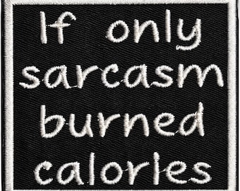 May include: A square embroidered patch with a black background and a white border. The patch features white embroidered text that reads: If only sarcasm burned calories. The lettering is in a simple, rounded font style centered on the fabric.