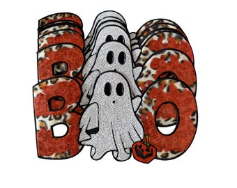 May include: A decorative patch set featuring the word BOO with the letters B and O rendered in orange sequins and a leopard print pattern. Between the letters is a white ghost figure with black eyes and a small orange jack-o'-lantern.