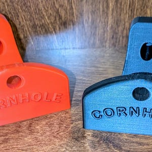 Soportes de pared para tableros de cornhole
