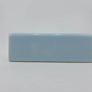 May include: A rectangular, light blue ceramic container with rounded edges. The object has a glossy finish and a small opening on the top. The container is set against a white background.