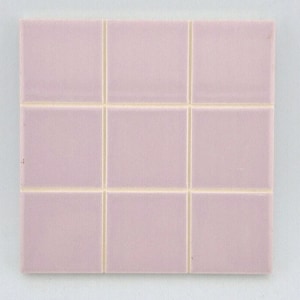 May include: A square of nine pink ceramic tiles with light beige grout lines. The tiles have a subtle vertical texture, creating a grid pattern. The overall color palette is soft and muted, suitable for various design applications.