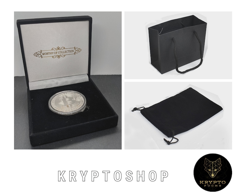 May include: A silver coin with a Bitcoin logo is displayed in a black velvet box with a white interior. The box has a gold inscription that reads "Worthy of Collection". The coin is also included in a black velvet pouch and a black paper shopping bag.