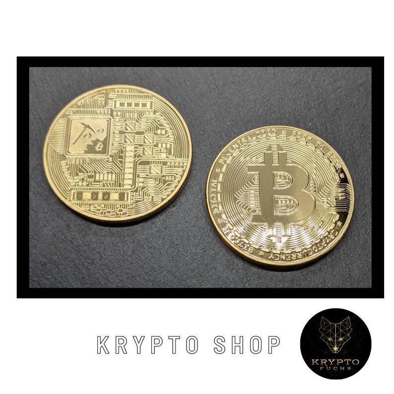 May include: Two gold-colored Bitcoin coins. One coin features a circuit board design with a pickaxe and the text "BTC". The other coin features the Bitcoin symbol and the text "Decentralized Peer to Peer Digital Currency".