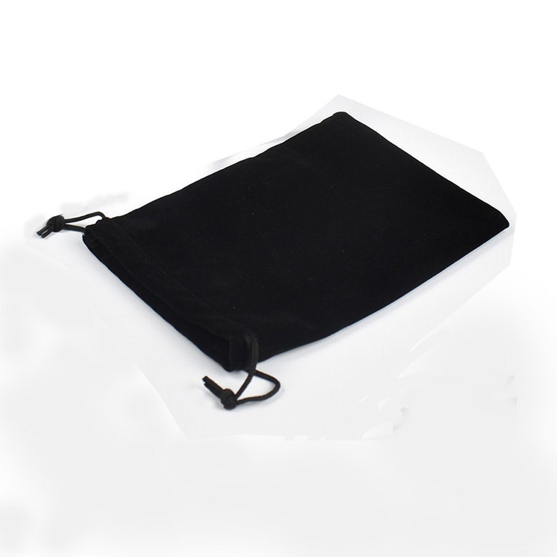 May include: A black velvet drawstring pouch with a black cord.