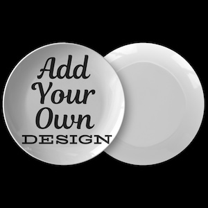 May include: Two white ceramic plates, one with the text "Add Your Own DESIGN" in black.