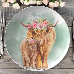 Watercolor Hereford farm floral cow and calf white round dinner plate, made of a polymer composite which is oven safe, microwave safe, and dishwasher safe. Thermosaf. Farmhouse dinnerware.