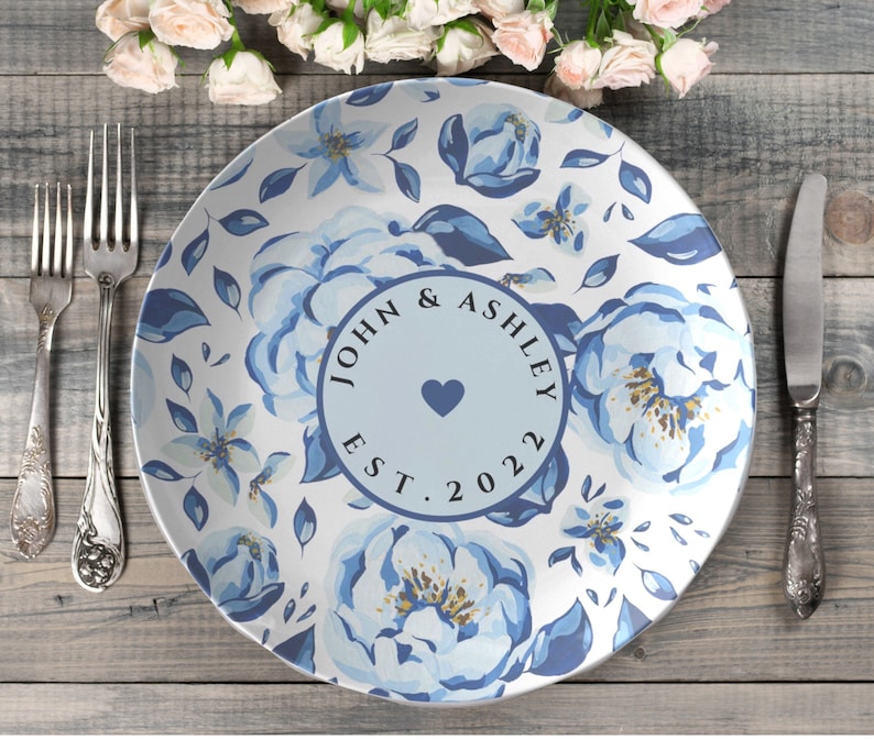 Custom blue floral personalized Mr. and Mrs. monogrammed wedding or anniversary, white round dinner plate, made of a polymer composite which is oven safe, microwave safe, and dishwasher safe.