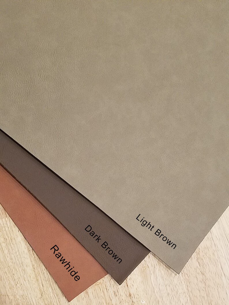 May include: Four leather swatches in different shades of brown. The swatches are labeled "Rawhide", "Dark Brown", "Light Brown", and are arranged from darkest to lightest.