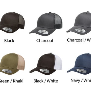 May include: Six different colored trucker hats with a mesh back. The hats are black, charcoal, charcoal with a white mesh back, green with a khaki mesh back, black with a white mesh back, and navy with a white mesh back.