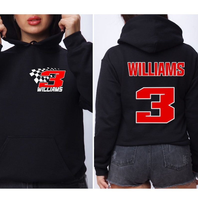 Op de afbeelding: Zwart hoodie met een rood nummer 3 en het woord "WILLIAMS" op de voor- en achterkant. Het nummer 3 is wit omrand en heeft een geruit vlagontwerp op de voorkant.