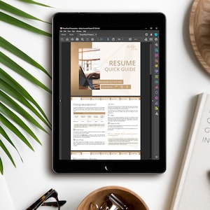 May include: A tablet screen displaying a digital document titled "Resume Quick Guide" with a gold and white color scheme. The document includes a section titled "Congratulations!" and a section titled "Installing Fonts".