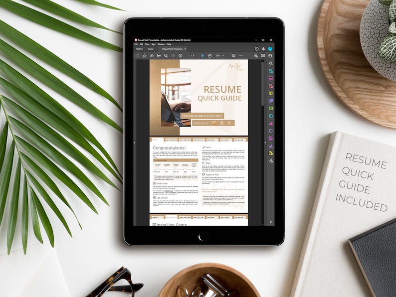 May include: A tablet screen displaying a digital document titled "Resume Quick Guide" with a gold and white color scheme. The document includes a section titled "Congratulations!" and a section titled "Installing Fonts".