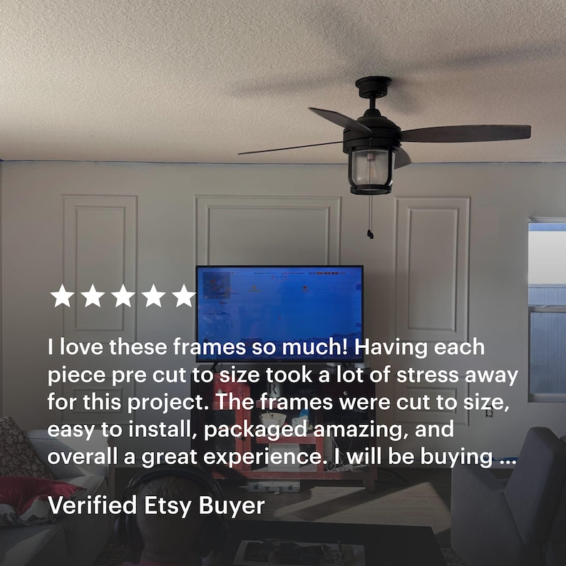 A room with white wall molding kit . The walls feature decorative rectangular frames. A television is mounted on the wall. Text on the image reads: "I love these frames so much!" and "Verified Etsy Buyer."