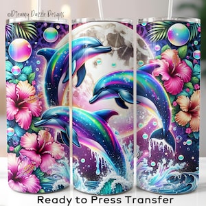 May include: A tumbler featuring a vibrant design of three dolphins leaping in front of a full moon, surrounded by tropical flowers and bubbles. The dolphins have rainbow-colored accents. The text "Ready to Press Transfer" is at the bottom.
