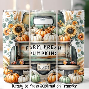 May include: A tumbler featuring a watercolor design of a vintage green truck filled with pumpkins. The truck bed reads "FARM FRESH PUMPKINS." Sunflowers and foliage surround the truck. The bottom of the tumbler reads "Ready to Press Sublimation Transfer."