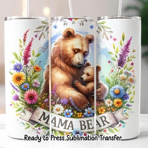 May include: A white tumbler featuring a watercolor illustration of a mother bear and cub, surrounded by colorful flowers. The words "MAMA BEAR" are on a banner. The text "Ready to Press. Sublimation Transfer" is at the bottom.