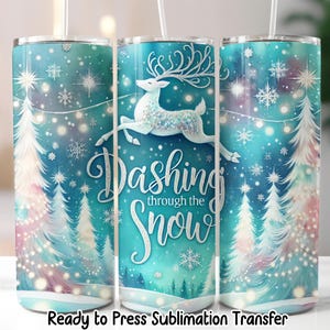 May include: A set of three insulated tumblers with a winter theme. The design features a reindeer, snowflakes, and Christmas trees on a teal background. The text "Dashing through the Snow" is displayed on the front of the tumbler.