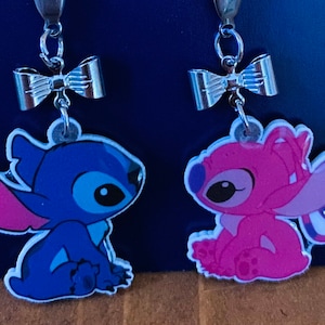 Disney stitch and angel drop earrings.