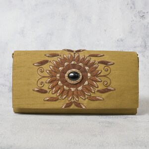 Timeless Opulence: Antique Gold Silk Flap Bag Adorned with Onyx Gemstone