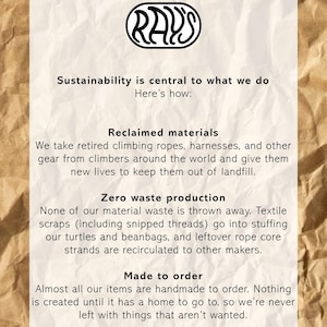 May include: A white informational sign with black text on a crumpled brown paper background. The text reads: RAY'S, Sustainability is central to what we do, Here's how: Reclaimed materials, Zero waste production, and Made to order with descriptions.