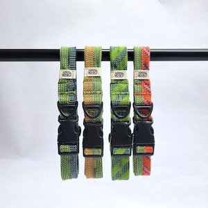 May include: Four woven fabric collars with black plastic side-release buckles and D-rings. Each collar features a unique multi-colored geometric pattern in shades of green, orange, and blue, with a small rectangular label reading RADS.