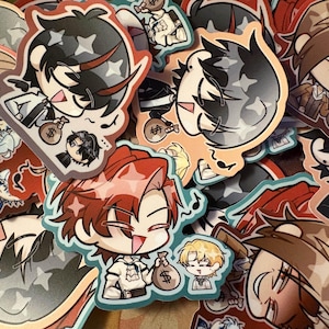 May include: A collection of colorful anime-style stickers. The stickers feature various characters with unique hairstyles and expressions, some holding money bags. The designs incorporate musical notes and star patterns, with a variety of colors including red, black, and tan.