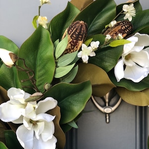 Magnolia wreath for front door with realistic white magnolia blooms nestled in green magnolia leaves with pods, ferns,blossoms all handmade. image 8