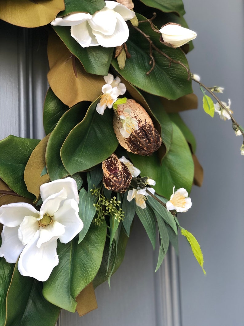 Magnolia wreath for front door with realistic white magnolia blooms nestled in green magnolia leaves with pods, ferns,blossoms all handmade. image 7