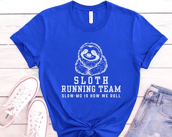 May include: A royal blue t-shirt with a white sloth graphic and the text "Sloth Running Team Slow-Mo Is How We Roll".