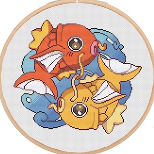 May include: A cross-stitch pattern featuring three cartoon fish. The fish are orange, yellow, and blue. The fish are swimming in a circle around each other.