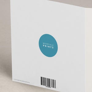 The image is a white card with a blue circular logo and a barcode on the bottom right corner.