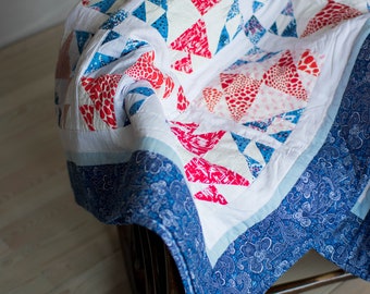 GOURAMI quilt. Handmade patchwork quilted bedcover. Stylish modern geometric blanket. Queen size bedspread. Bright white blue and red plaid.