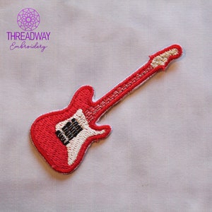 May include: A red embroidered guitar patch with white edging and black and white details. The patch features the text "THREADWAY Embroidery" and a circular design in the upper left corner.