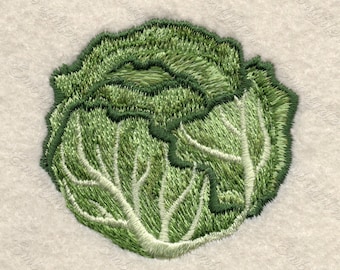 May include: A green embroidered cabbage with a white background.