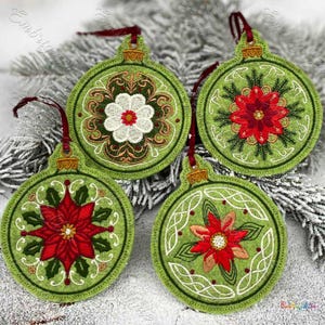 May include: Four green felt Christmas ornaments with embroidered designs. Each ornament features a different floral pattern in red, white, and gold thread. The ornaments are perfect for adding a touch of handmade charm to your holiday decor.