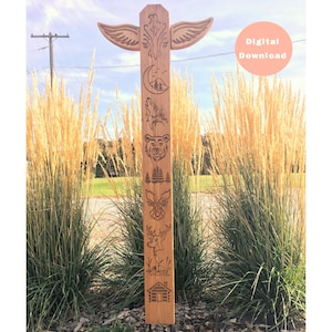 May include: A wooden totem pole with carvings of a bird, moon, wolf, bear, trees, deer, and a cabin. The pole is standing in front of a field of tall grass.