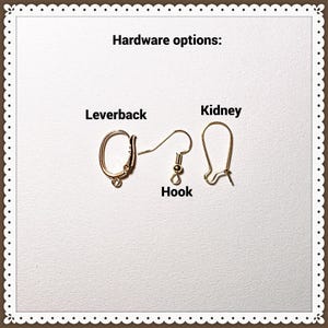 May include: Image showing three different gold-colored earring hardware options: leverback, hook, and kidney. The text "Hardware options:" is at the top. The earrings are displayed on a white background with a decorative border.