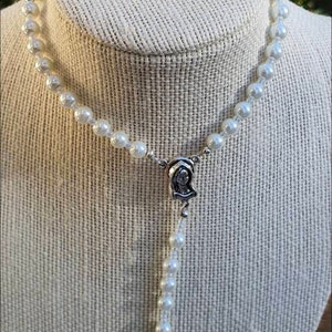 White pearl Rosary Beads.