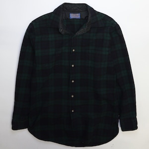 May include: A black and green plaid flannel shirt with a button-up front and long sleeves. The shirt has a quilted lining.