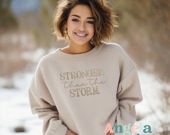 Stronger Than The Storm™ Embroidered Sweatshirt- Inspirational Apparel