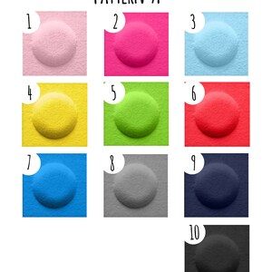 K&ouml;nnte beinhalten: Farbkarte Muster A mit zehn verschiedenen Farben. Die Farben sind rosa, pink, hellblau, gelb, gr&uuml;n, rot, blau, grau, dunkelblau und schwarz.